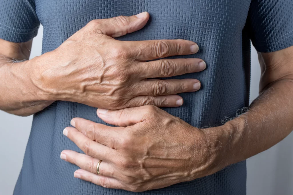 closeup shot of a man with his hands placed over h utc