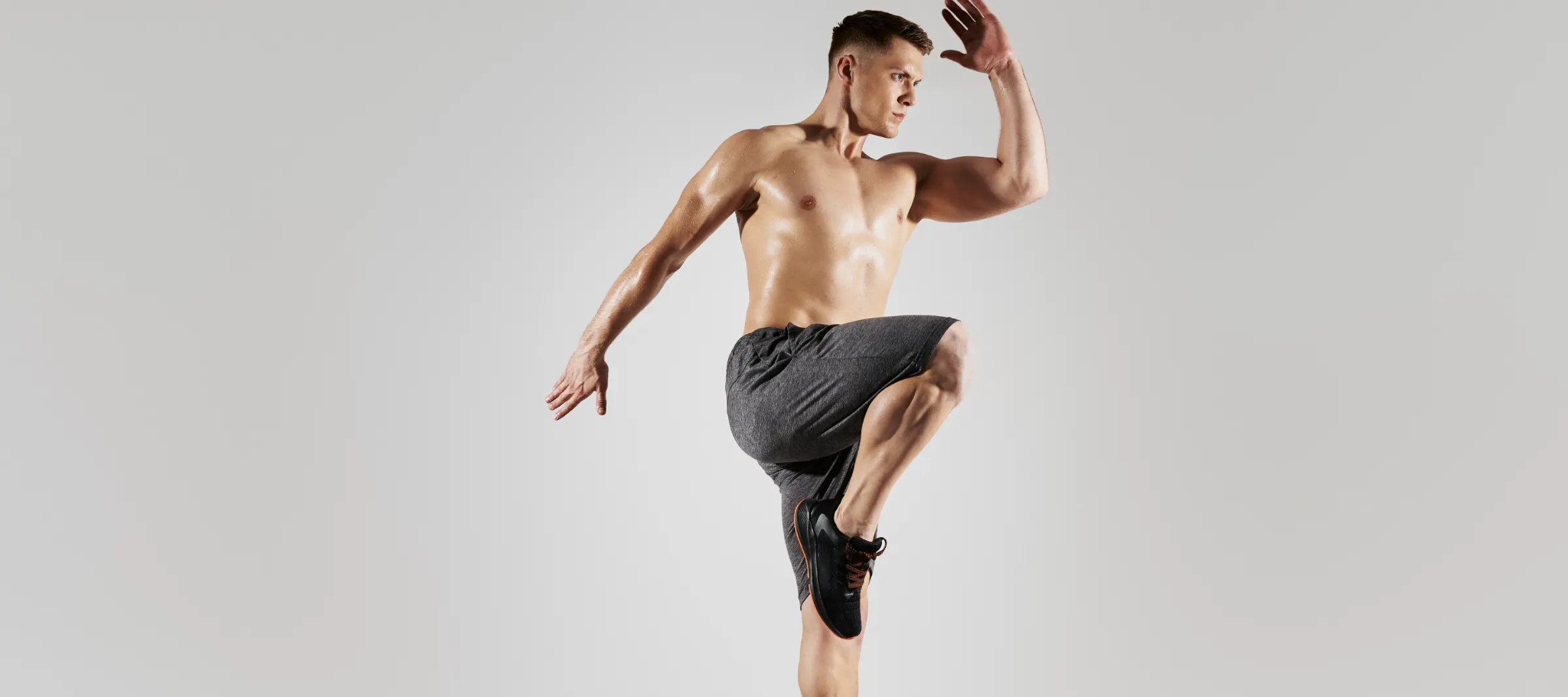 confident young man with perfect body jumping agai utc