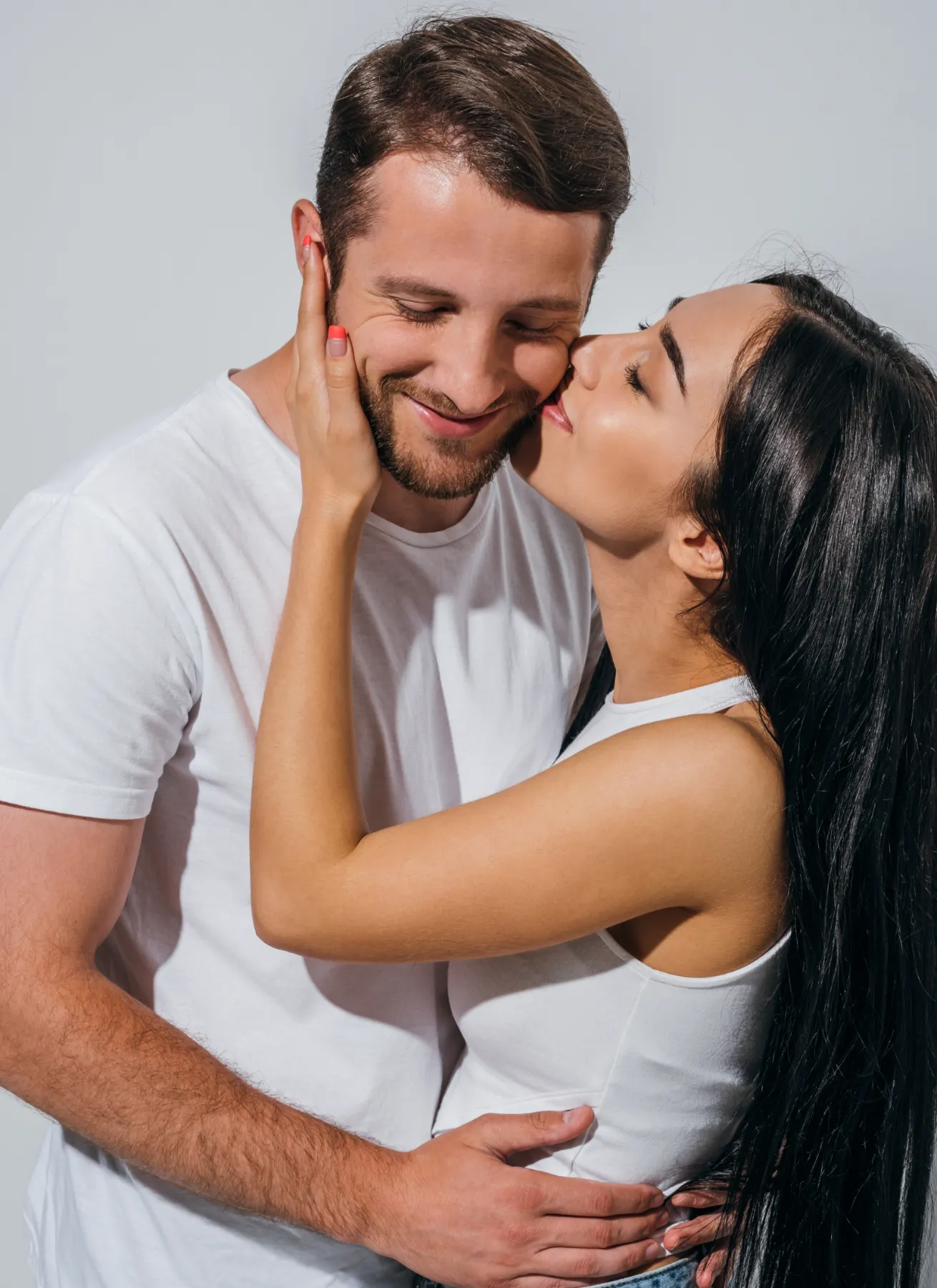 happy young man and girl hugging and kissing with utc