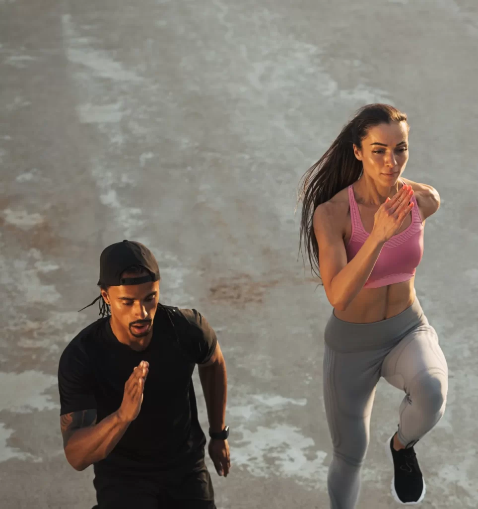 high angle of two athletes running together on the utc