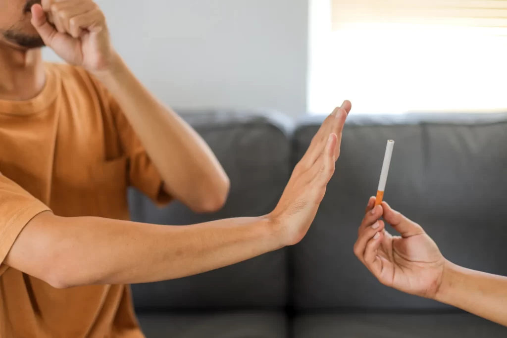 man refusing cigarette at home quitting smoking c utc