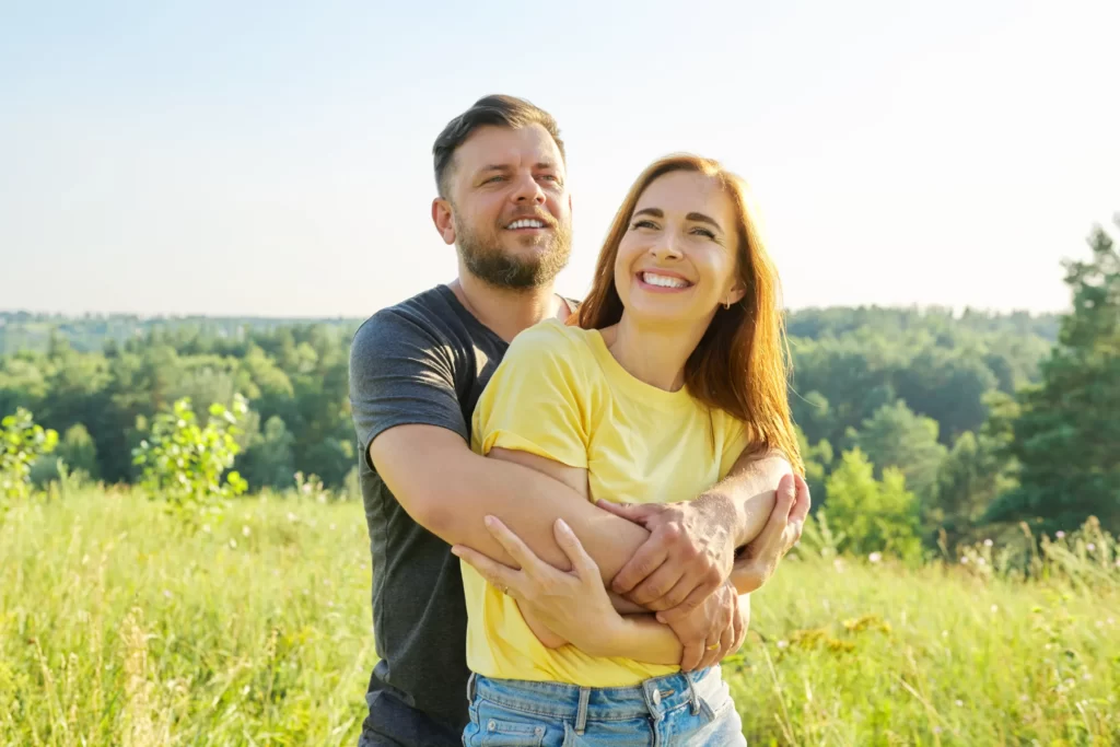 portrait of happy adult couple on summer sunny day utc