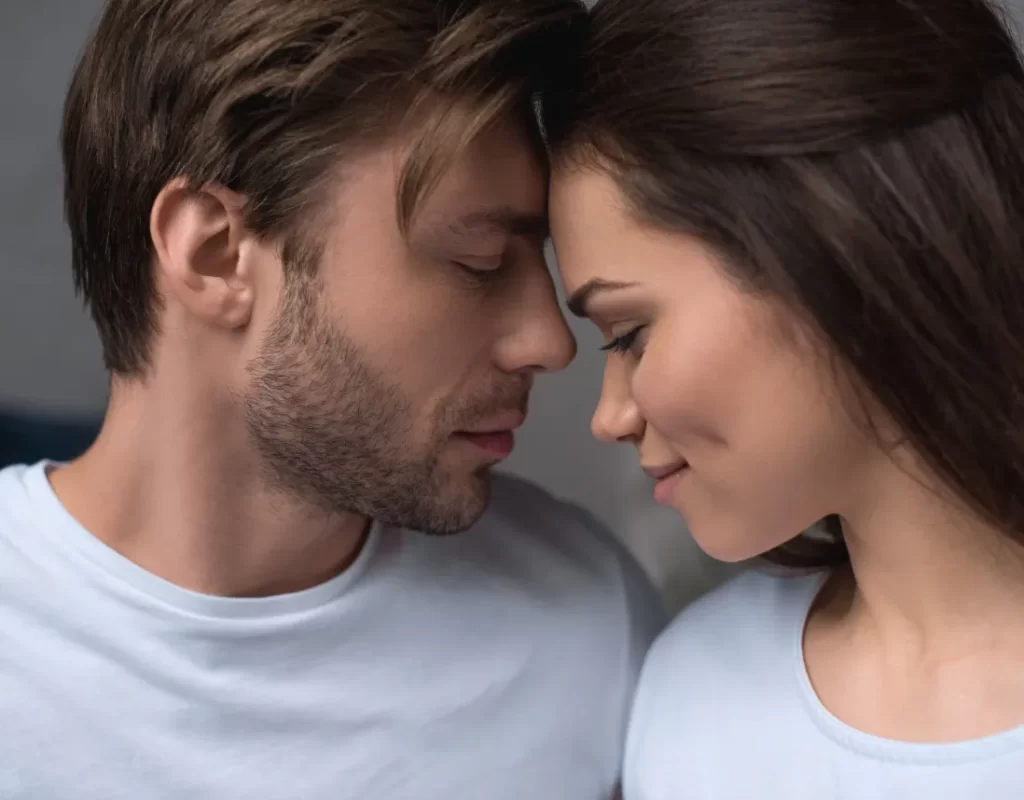 romantic couple tenderly hugging in their room utc